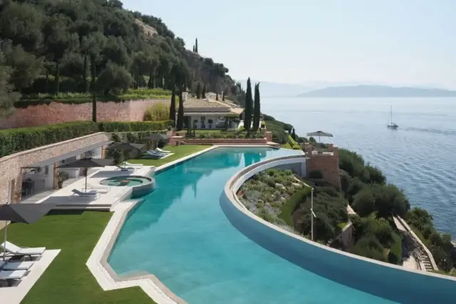 Melissonia, 
📍Nissaki, Corfu

Sleeping up to 12 guests across eight beautifully designed bedroom suites, Melissonia is an exceptional private estate with 180-degree sea views. 

Outside, there is a fabulous 65m infinity pool with cabana featuring bar, dining area, service kitchen and relaxed seating, making it an inviting place to spend long summer days.

In the main house, five bedroom suites, while the separate guest house provides three further suites, offering privacy and space for larger groups. 

A house jetty offers direct sea access for swimming and boat mooring, and there’s also a separate sea-level swimming platform.

Inside, the estate combines elegant interiors with a cinema room, large bar, TV snug, gym, table tennis and table football. 

In addition, the house chef will provide breakfast and one main meal six days a week, supported by a front-of-house team, house manager and daily housekeeping and evening turndown.

This truly is the most remarkable setting for experiencing Corfu at its most private and relaxed.

For further detail details or to book direct, please contact us: 

📧 info@ionianestates.com or 
📞 44 (0) 7540 472 746

#Corfu #CorfuLuxury #CorfuLuxuryVilla #LargeLuxuryVilla #IonianEstates